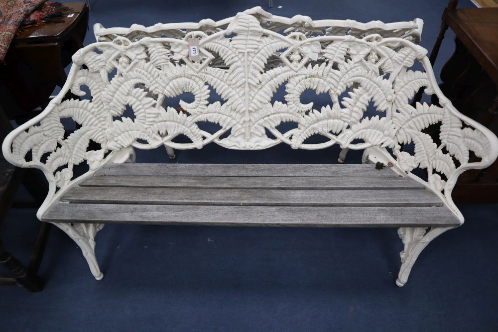 A pair of Coalbrookdale style cast iron garden benches, in fern pattern, with teak slats, width 151cm, depth 26cm